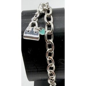 Source Unknown Silver Bracelet with Handbag and Blue Charm